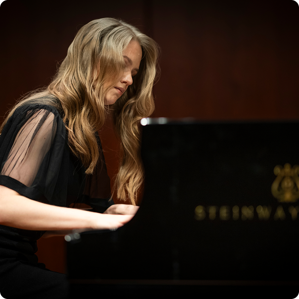 Side profile of pianist at piano